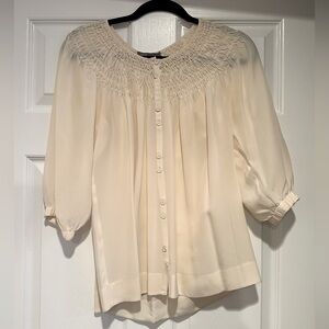 Off white blouse with detailed neckline